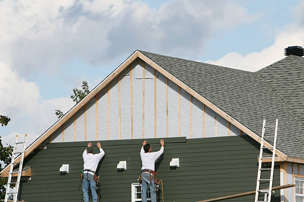 Professional Siding technician working in Fairview, OR